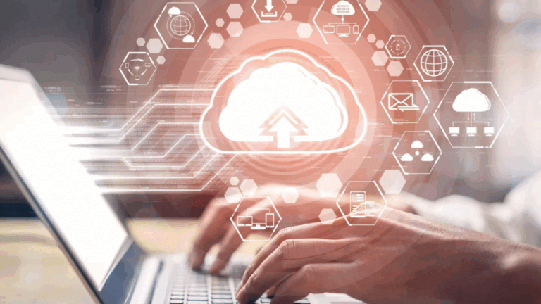 Man sits at his laptop working on various tasks via cloud solutions